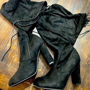 Thigh high boot/heels. Black, Above the knees.